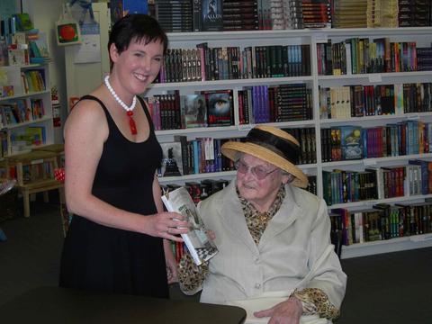 Danielle Wood presents Marjorie Bligh with a copy of *Housewife Superstar*